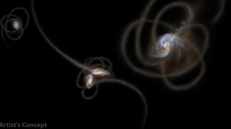 Artystyczna wizja strumieni gwiazd wyrzuconych z galaktyk. Według hipotezy mogą one być odpowiedzialne za świecenie tła nieba w podczerwieni. Źródło: NASA/JPL-Caltech/UC Irvine